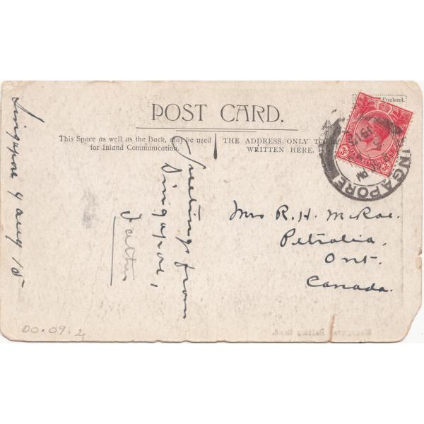 The back of a postcard sent to Mrs. McRae. The paper is cream-coloured and there is a red postage stamp in the top right corner with a black postmark inked on top of it. 