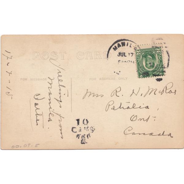 Back of a postcard with a message and address of the recipient. There is a green stamp and a postmark.  