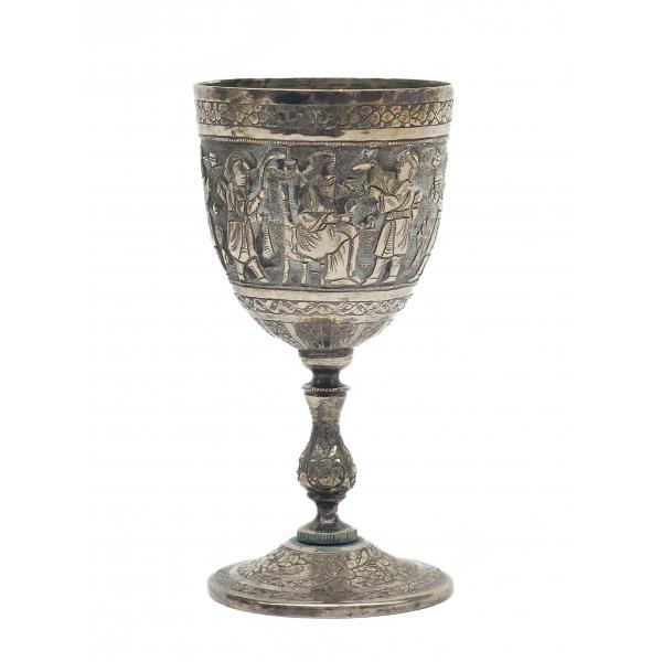 Front view of a silver goblet decorated with bands of flowers which frame a main offering scene.  