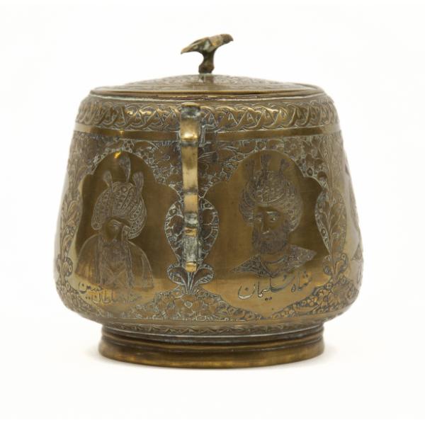 The left side of a brass sugar bowl showing two of the sultan portraits. They are surrounded by a floral background. There is a brass bird on top of the lid.