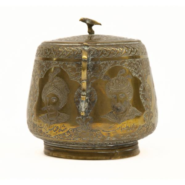 The right side of a brass sugar bowl showing two of the sultan portraits. They are surrounded by a floral background. There is a brass bird on top of the lid. 