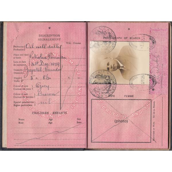 Pages 2 and 3 of a passport belonging to Fred Webb with his personal description and photograph. The pages are pink and information has been filled in with ink. There is a black stamp on each corner of the photograph. 