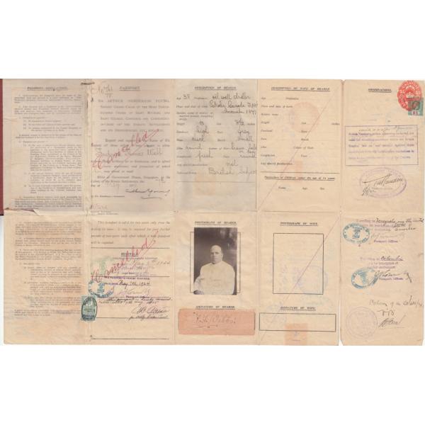 Inside of the passport showing the personal information of Fred Webb, as well as his picture and renewal stamps.  