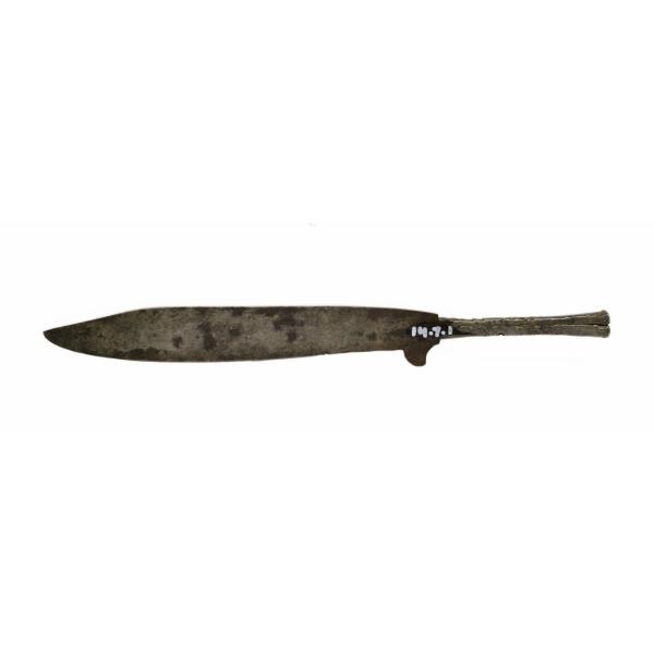 A metal knife with a plain handle, facing left. There is a fin coming off of the bottom of the blade near the handle. 