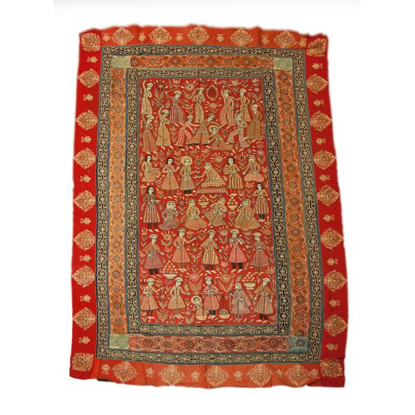 A red and gold embroidered throw rug. There are six rows of figures surrounded by four rows of patterned borders. 