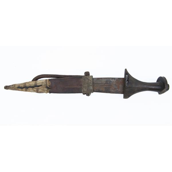 A double-edged knife with a smooth, dark wooden handle. The blade of the knife has three grooves running down its length. The leather sheath has decorations along the front and a twisted rope handle. The tip of the sheath is coated in a light material. 