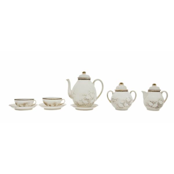 A white, bone china tea set consisting of two tea cups and saucers, a teapot, creamer, and sugar bowl, decorated with white ibis birds. There are lids rimmed with gold on the teapot, creamer, and sugar bowl.