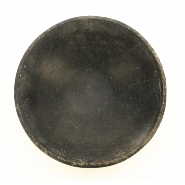 A top view of a black bowl. 