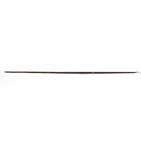 A straight, dark wooden bow. There are notches for attaching a string at both ends and the string is laying along the bow. There are four bands of brown string wrapped along the shaft for decoration.