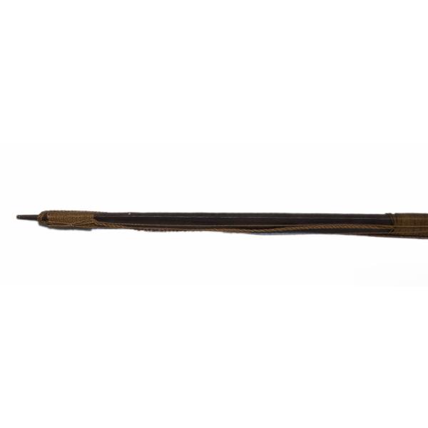 The end of a dark wooden bow. There is a notch for attaching the string of the bow, and the string is laying alongside. There is a band of brown string wrapped around the shaft at the end for decoration.