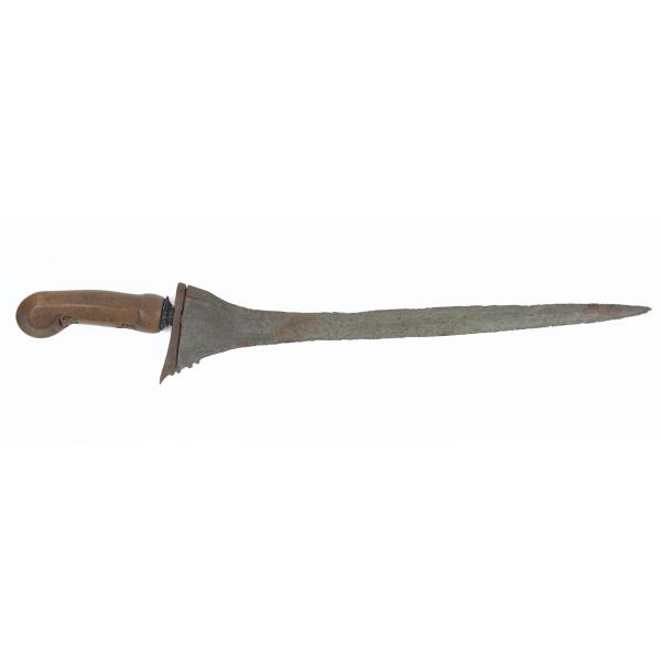 A metal knife with a wooden handle pointing right. There are carvings on the underside of the handle. 