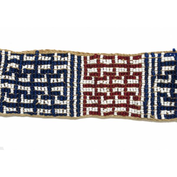 White, blue, and red beads woven into a geometric design, forming a rectangle with a twine border.