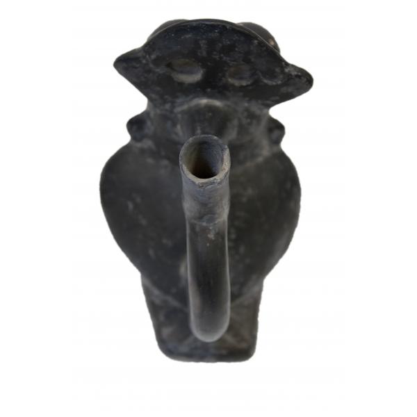 Back side, top of the black stirrup-spout vessel shaped like a bird, showing the spout. 