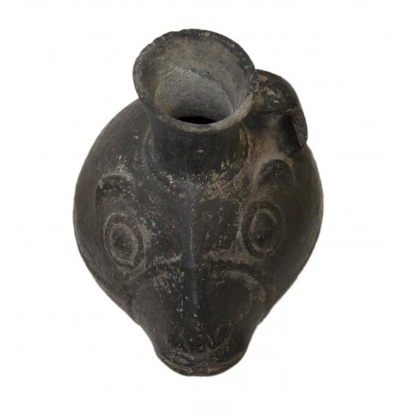 Top view of black stirrup-handle jug, shaped like a llama's head.