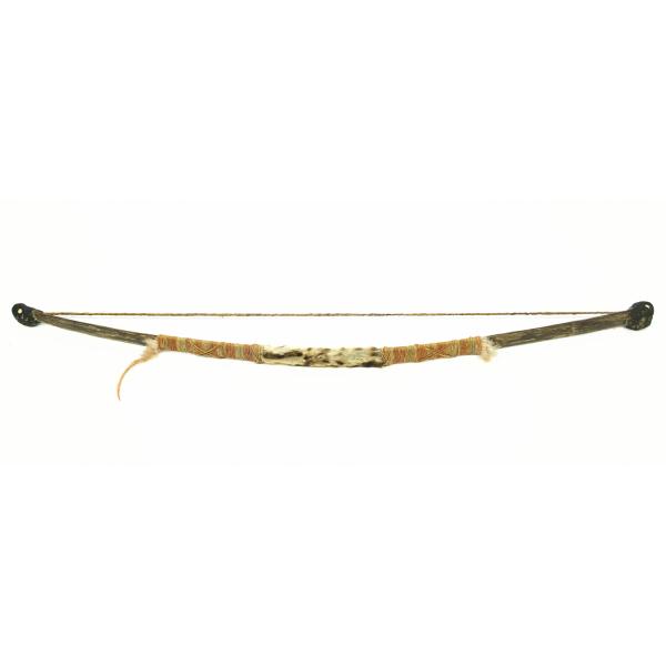 Toy wooden bow with orange and green hemp wrapped along the handle, with feathers and animal fur.