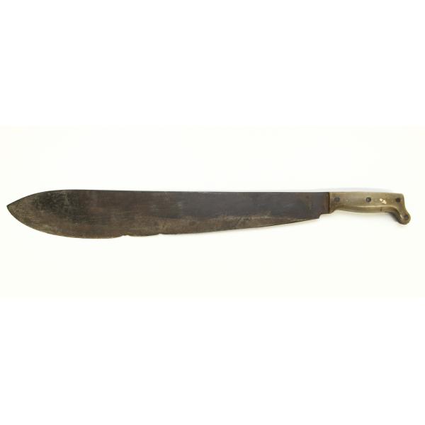 A metal machete with a long, curving blade and a bone handle with a dark wooden base, pointing to the right. There is a small image of a sun on the blade right next to the handle. 