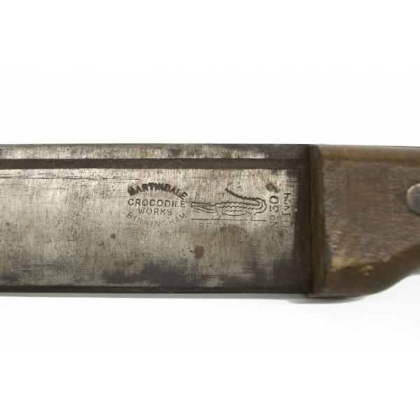 Close-up view of the maker's mark with a crocodile logo on the blade right next to the handle. The mark reads: "Martindale Crocodile Works. Birmingham England. No 30. 20 Inch". 