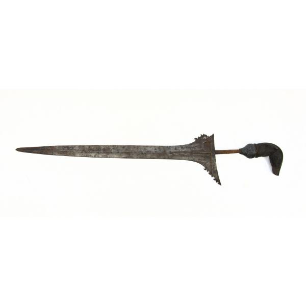 A dagger blade pointing left. It has a metal blade that flares at the hilt and a carved wooden handle in the shape of a bird. 