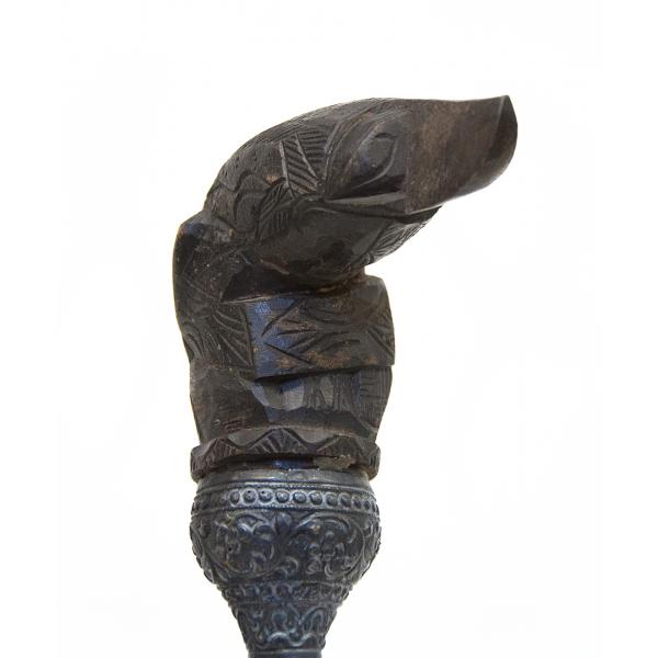 The handle of a dagger blade carved like a bird.  