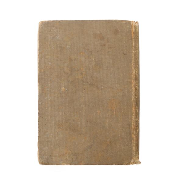 The back cover of a book. It is brown and plain. The binding and edges are worn.