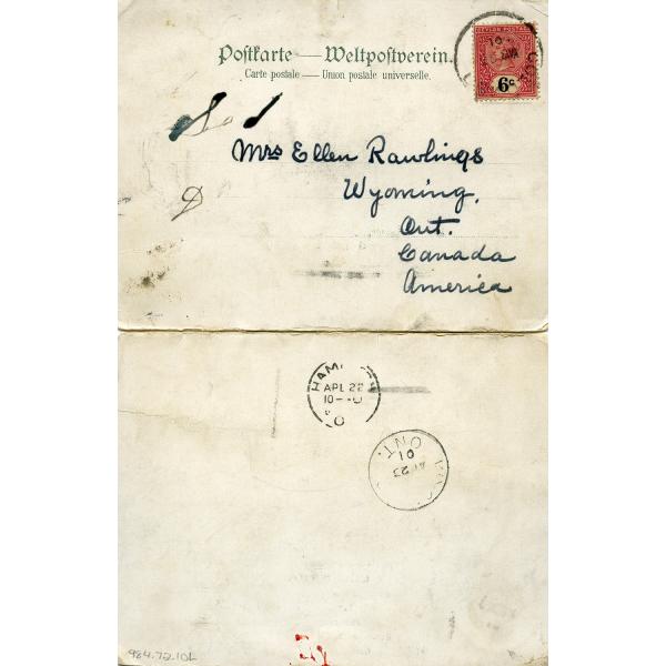 The back of a letter on off-white paper addressed to Mrs. Rawlings. There is a red paper stamp in the top right corner and three black ink postmarks.  )