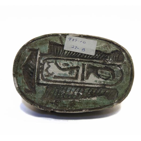 Bottom view of the cartouche inscribed into the green-painted scarab. 