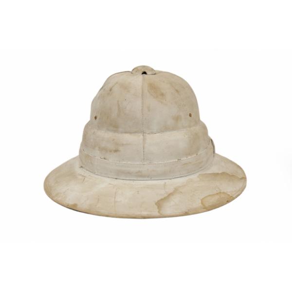 A white pith helmet with a high top. It is well worn and dirty. 