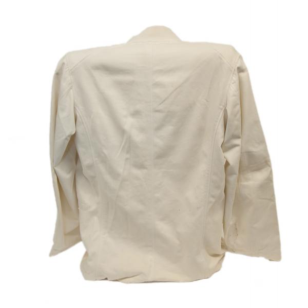 The back of a white jacket. It is slightly wrinkled and the sleeves hang limply at the sides.