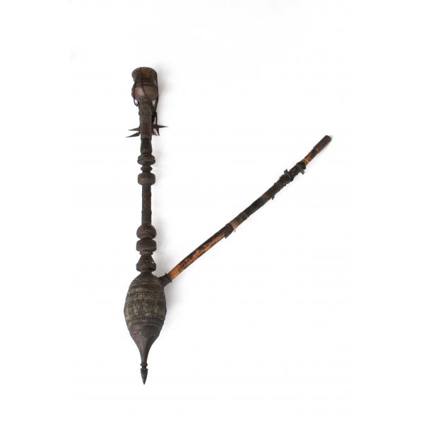 A Persian water pipe made from wood and hammered metal.  