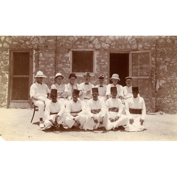 Photograph of six oil drillers in Egypt with five members of the serving staff