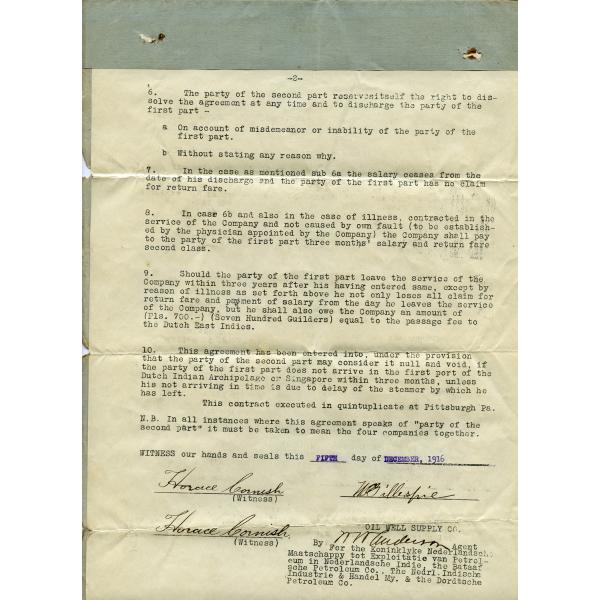 A yellowing piece of paper with typewritten black text. Additional information has been typed in with blue ink. There are signatures at the bottom. There is a line of blue-grey material along the top. The paper has three crease marks, spaced evenly apart and running horizontally. 
