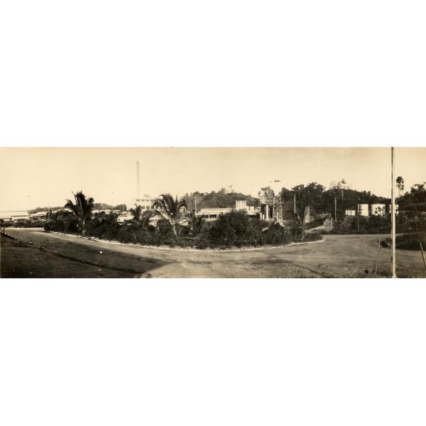 The road leading into the Tropical Oil Company facility in El Centro, Colombia. The facility is in behind a group of trees.