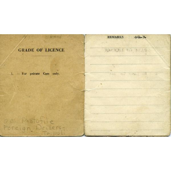 Inside the cover of a driving licence. The left side is light brown and has "Grade of Licence. 1. - For private Cars only." written on it. The right is yellowed paper with dotted lines and the word "Remarks" written at the top.