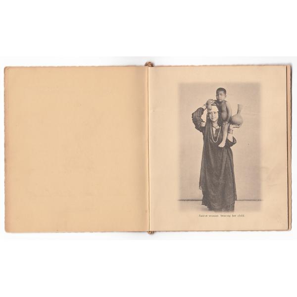 First picture of an Egyptian woman carrying a small boy on her shoulder and holding a vase. 