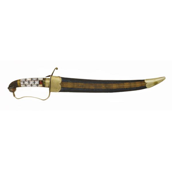 A sheathed dagger pointing right. The tip and hilt are gold and there is a strip of gold fabric along the blue velvet sheath. There is mother-of-pearl inlaid in the haft.