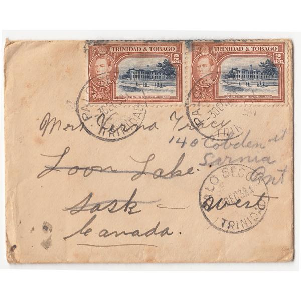 The front of an envelope that contained a Christmas card addressed to Mrs. Tracy. There are two stamps and three postmarks from Trinidad & Tobago.