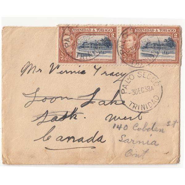 The front of an envelope that contained a Christmas card. It is addressed to Mr. Vernie Tracy and has two stamps as well as a postmark from Trinidad & Tobago.