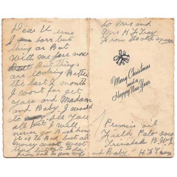 The inside of a Christmas card sent by Humphrey Tracy to his son Verne. The card says, "Merry Christmas and a Happy New Year". There is also a handwritten note from Mr. Tracy. 