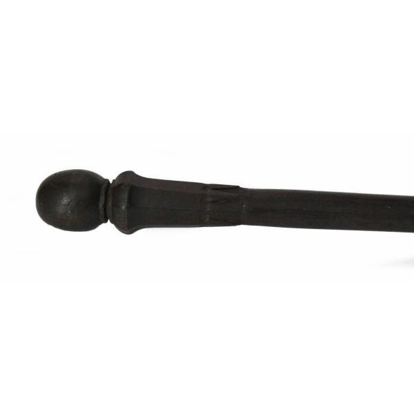The handle of a dark wooden cane. It is shaped like a sphere. There are ridges where it connects to a plain shaft.
