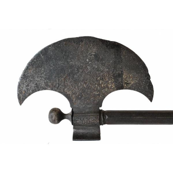 The blade of a Persian saddle-axe. The blade is curved and there is a design incised on the flat part.