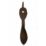 The front of a wooden carved spoon decorated with diagonal hatching on the handle. There is a triangular hole in the middle of the handle and a stem at the top.  