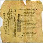 An advertisement printed on yellow paper. The paper is wrinkled and torn along the edges. There is an image of an alcohol bottle in the centre, with writing in Japanese to the left and English on the right. 