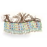 A colourful beaded necklace with leather fringe and hanging cowrie shells. The beads are blue, green, yellow, and red. 