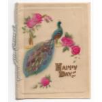 The front of a Christmas card. There is a blue, green, purple, and gold peacock sitting on a branch that has pink flowers. The card says "Happy Days" and there is a piece of white string along the fold.