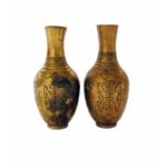 A pair of brass vases with a symmetrical line pattern on the body and a line design on the necks.