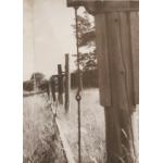 Close-up of wire hangers holding the ash poles of the jerker lines.