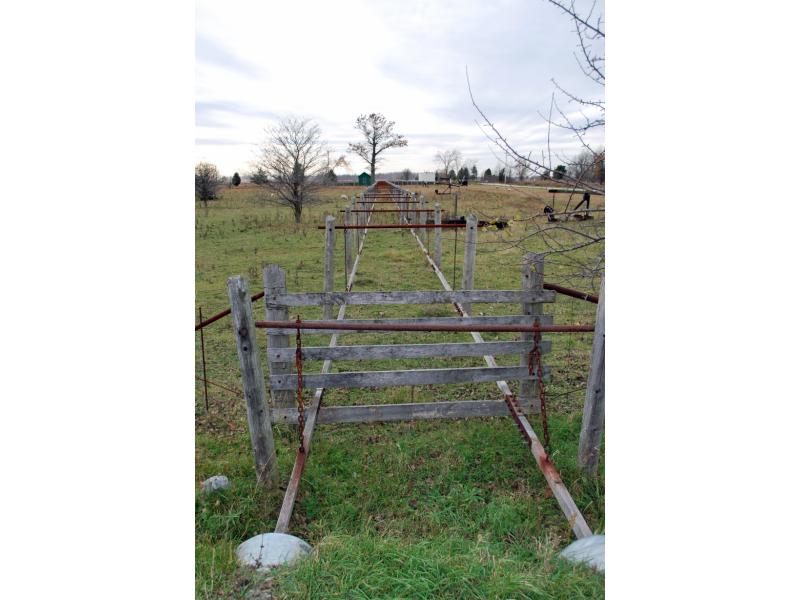 A connected set of jerker lines emerging from culverts and heading off into the distance across a field.