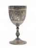 Front view of a silver goblet decorated with bands of flowers which frame a main offering scene.  