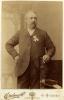 Portrait photograph of Matthew Porter in a suit. "Creelman & Co, Sydney Arcade, Sydney" is printed along the bottom.