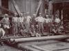 Joe O'Donnell and his crew posed in front of an oil rig. 